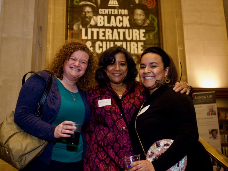 Three smiling people at Central Library